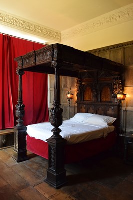 Lot 63 - Impressive carved oak and marquetry-inlaid tester bed