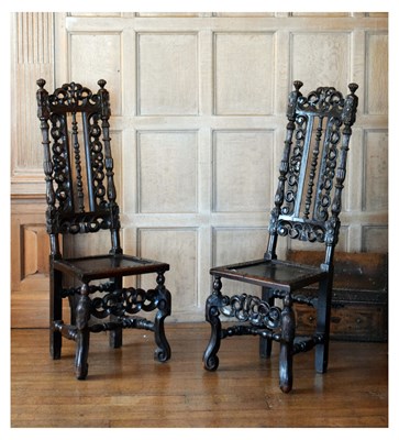 Lot 83 - Pair of late 17th Century carved oak high-back chairs