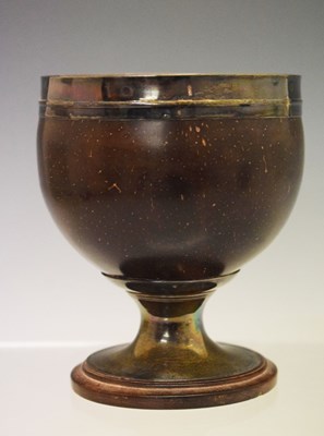 Lot 332 - Georgian silver mounted coconut cup