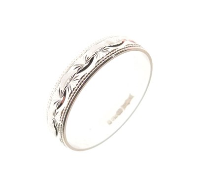 Lot 24 - 18ct white gold engraved wedding band
