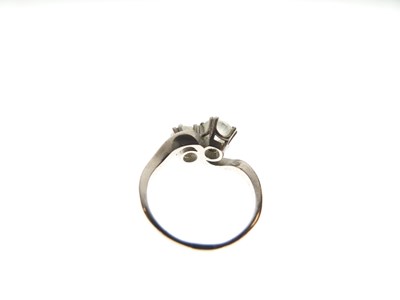 Lot 276 - Two-stone diamond crossover ring