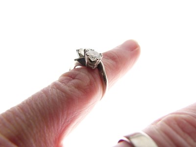 Lot 276 - Two-stone diamond crossover ring