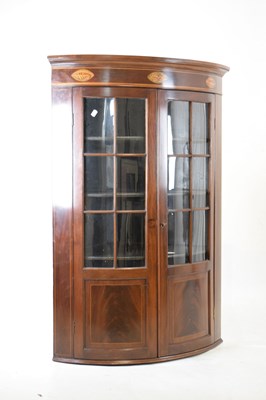 Lot 600 - Mahogany bow front corner cupboard