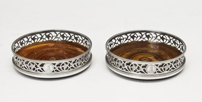 Lot 331 - Pair of George III silver wine coasters