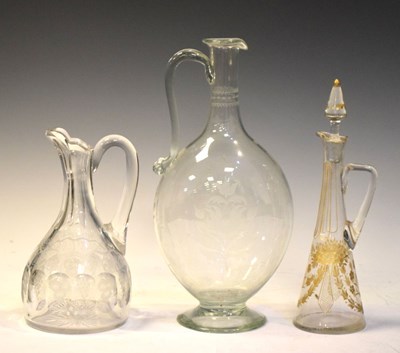 Lot 400 - Two etched jugs and a gilt bottle