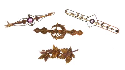 Lot 33 - Four gold brooches
