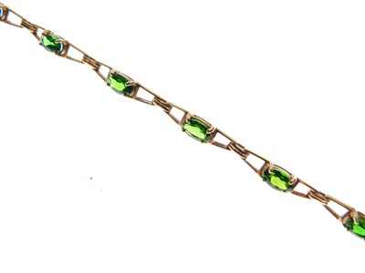Lot 65 - 9ct gold and green gem-set bracelet