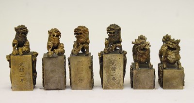 Lot 492 - Set of six Chinese cast metal desk seals