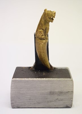 Lot 390 - Cast bronze miniature of a tiger with tooth terminal