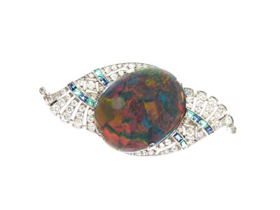 Lot 330 - Black opal, diamond, calibré emerald and sapphire brooch