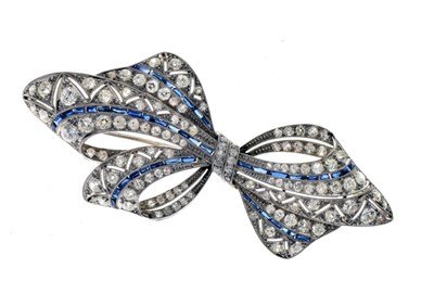 Lot 45 - Diamond and calibré sapphire bow brooch