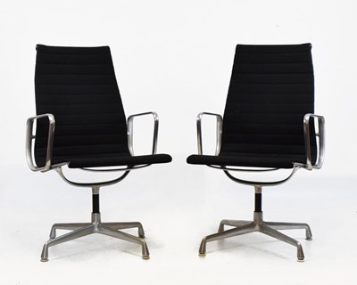 Lot 202 - Charles and Ray Eames - Pair of  swivel armchairs