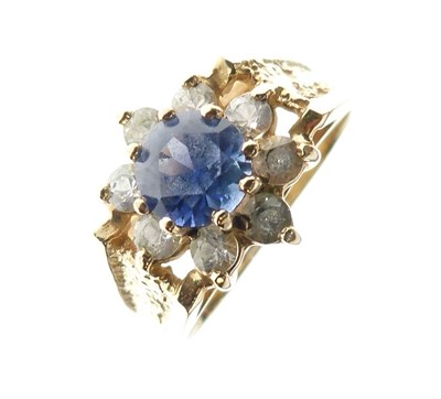 Lot 11 - 9ct gold. blue and white stone cluster ring