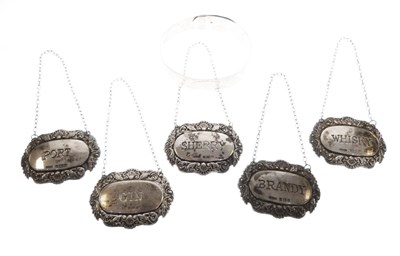 Lot 94 - Set of five silver decanter labels and a white metal bangle