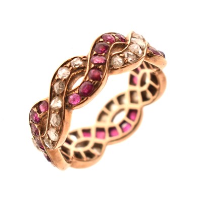 Lot 13 - Ruby and diamond crossover full eternity ring