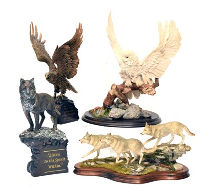Lot 301 - Four resin models of owls, wolves, etc.