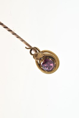 Lot 51 - A garnet set serpent stick pin