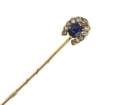 Lot 56 - A sapphire and diamond horseshoe stick pin