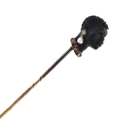 Lot 64 - A carved black onyx bust stick pin