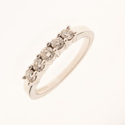 Lot 9 - 9ct white gold five-stone diamond half hoop ring