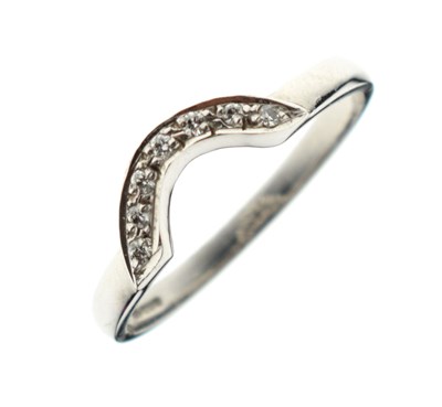 Lot 10 - 9ct white gold diamond set shaped wedding band