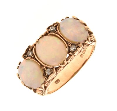 Lot 24 - 9ct gold three stone opal ring