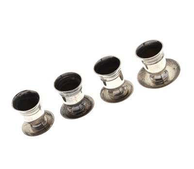 Lot 108 - Set of four white-metal miniature goblets, together with four associated saucers