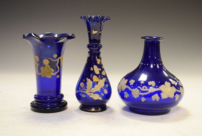 Lot 433 - Continental blue glass carafe and two similar vases