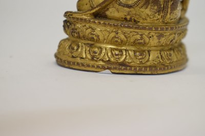Lot 465 - Small and fine early Tibetan gilt bronze figure of a bodhisattva