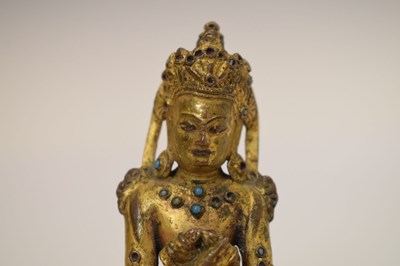 Lot 465 - Small and fine early Tibetan gilt bronze figure of a bodhisattva