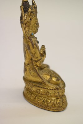 Lot 465 - Small and fine early Tibetan gilt bronze figure of a bodhisattva