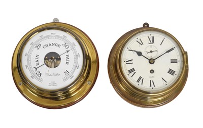 Lot 585 - Sestrel ships brass bulkhead timepiece, and later barometer