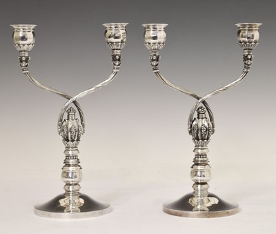 Lot 130 - Pair of Georg Jensen sterling silver two-branch candelabra