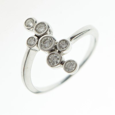 Lot 23 - 18ct white gold seven-stone diamond dress ring