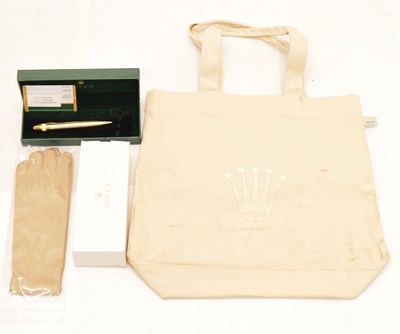 Lot 162 - Rolex - Gilt metal retractable ballpoint pen, pair of dealers gloved and tote bag