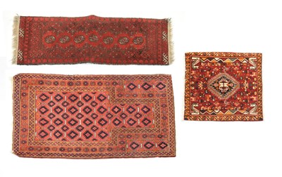 Lot 617 - Three Belouch red ground rugs