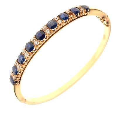 Lot 44 - Edwardian sapphire and diamond hinged bangle