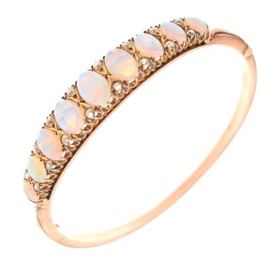 Lot 45 - Edwardian opal and diamond hinged bangle