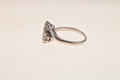 Lot 114 - Two-stone diamond crossover ring