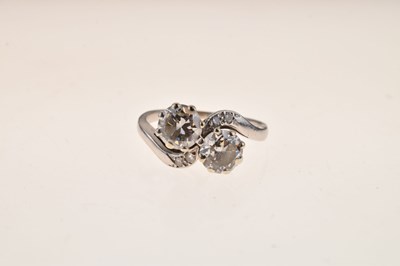 Lot 114 - Two-stone diamond crossover ring