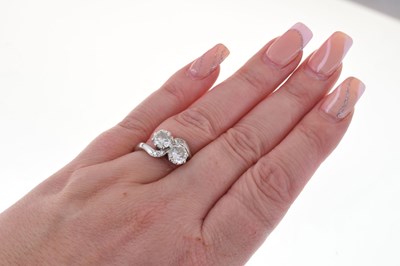 Lot 114 - Two-stone diamond crossover ring