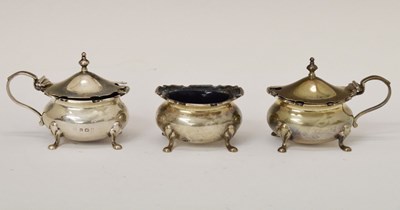 Lot 196 - George V silver three-piece condiment set with blue glass liners