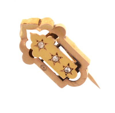 Lot 48 - Unmarked yellow metal brooch set three rose cut diamonds