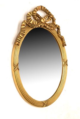 Lot 800 - Reproduction giltwood oval wall mirror