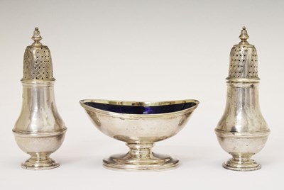 Lot 180 - George III silver boat-shaped salt and a pair of George V silver baluster form casters