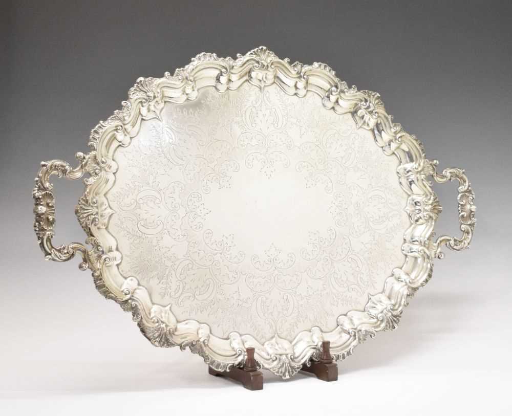 Lot 105 - Edward VII silver oval tray with scroll and shell moulded handles