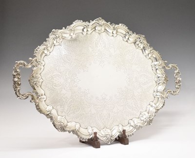 Lot 105 - Edward VII silver oval tray with scroll and shell moulded handles
