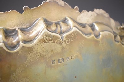 Lot 105 - Edward VII silver oval tray with scroll and shell moulded handles
