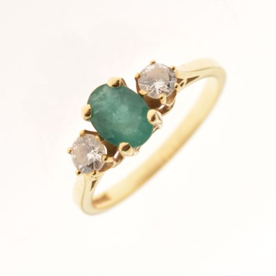 Lot 14 - 18ct gold emerald and diamond three-stone ring