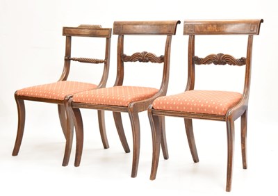 Lot 687 - Pair of George IV sabre leg dining chairs, together with one other